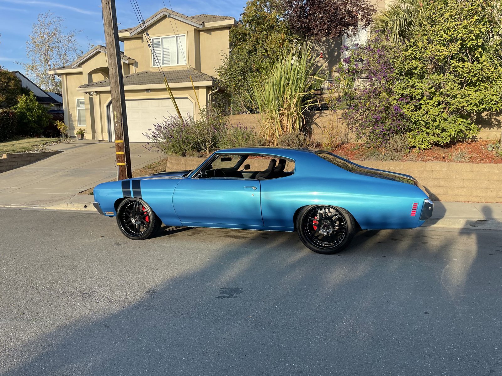 The Chevelle — side view with black wheels and red calipers